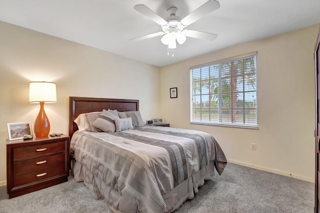 bedroom featuring ceiling fan and light carpet