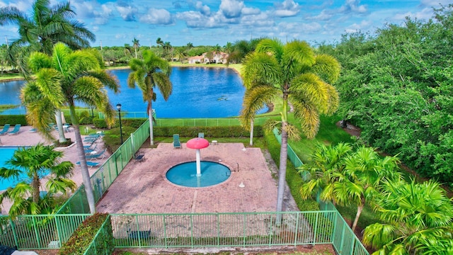 view of swimming pool with a water view