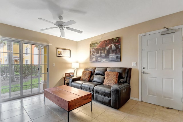 tiled living room with ceiling fan