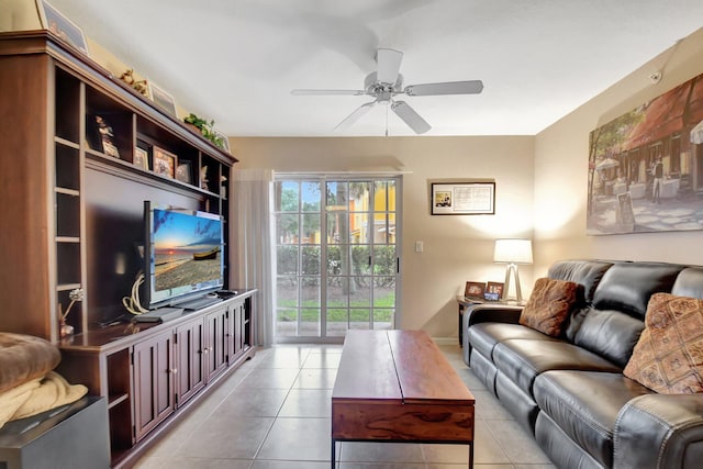 tiled living room with ceiling fan