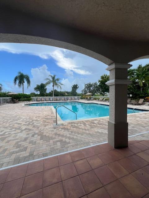 view of swimming pool with a patio