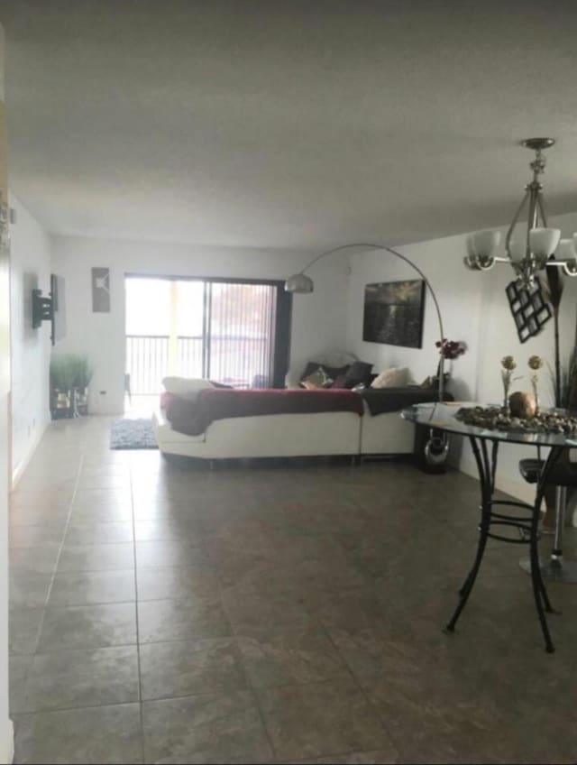 living room with dark tile patterned floors