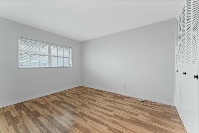 unfurnished room with light hardwood / wood-style flooring