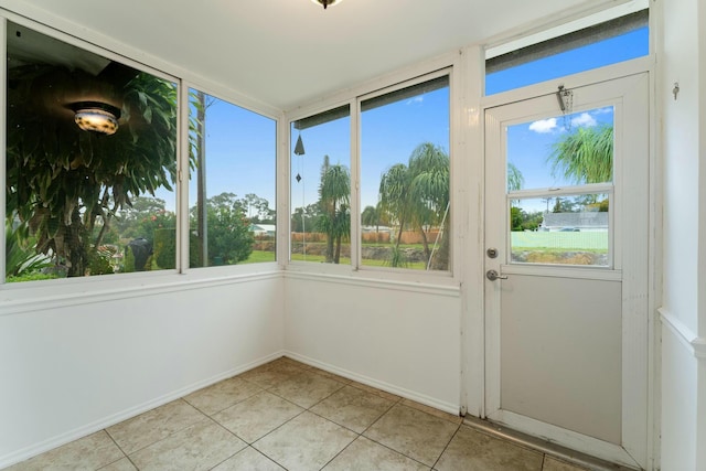 unfurnished sunroom featuring a wealth of natural light