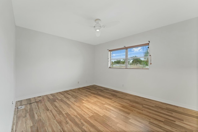 spare room featuring ceiling fan and light wood-type flooring