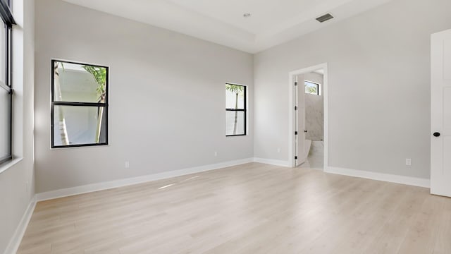 empty room with light hardwood / wood-style floors