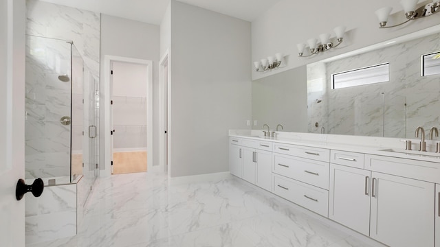 bathroom with an enclosed shower and vanity