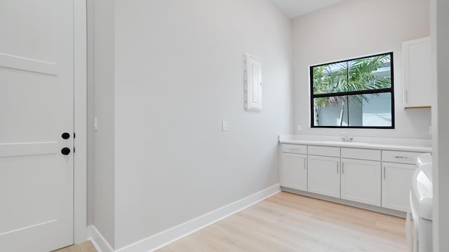 bathroom with vanity and wood-type flooring