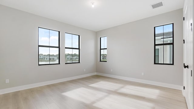 spare room with light wood-type flooring