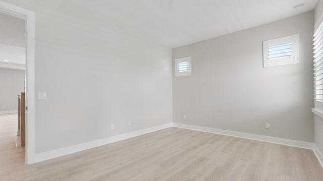 unfurnished room featuring light hardwood / wood-style floors