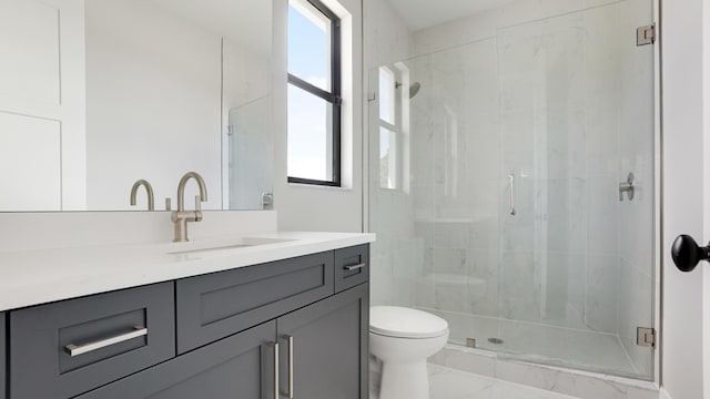 bathroom with vanity, toilet, and walk in shower