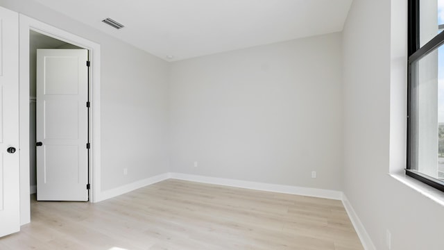 unfurnished room featuring light hardwood / wood-style flooring