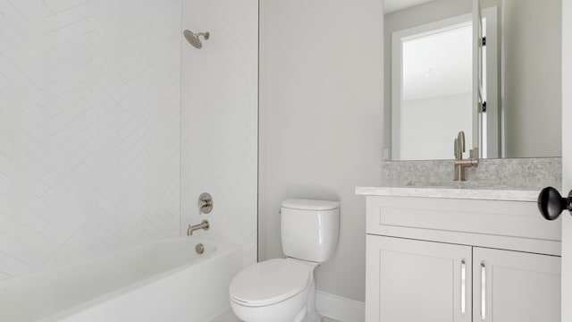 full bathroom featuring vanity, tiled shower / bath combo, and toilet