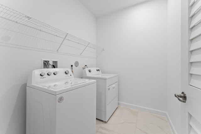 laundry area with washing machine and clothes dryer