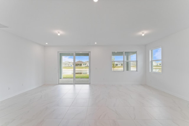 spare room featuring a wealth of natural light