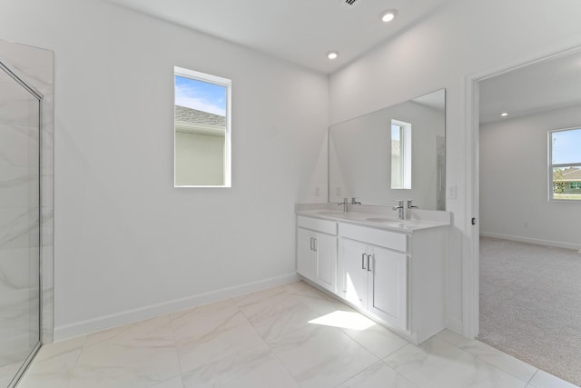 bathroom featuring vanity and a shower with shower door