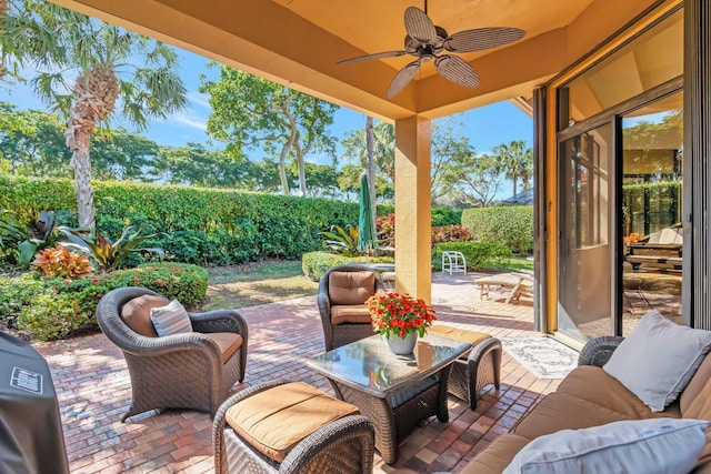 view of patio featuring an outdoor living space, grilling area, and ceiling fan