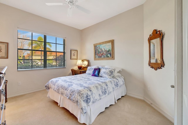 bedroom featuring ceiling fan and light colored carpet