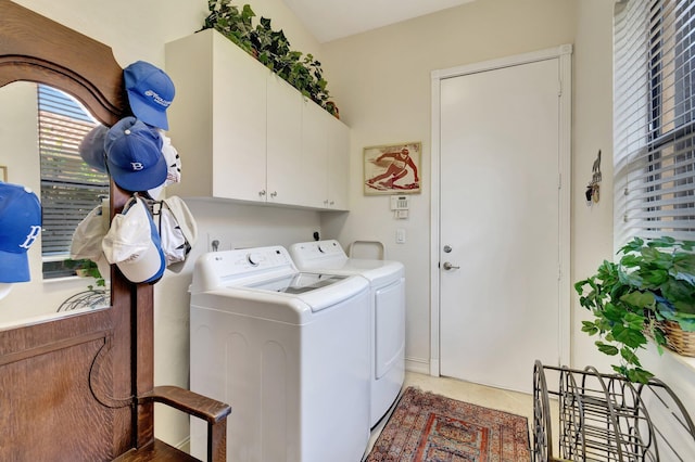 washroom featuring cabinets, tile patterned flooring, and washing machine and dryer