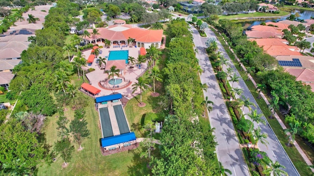 drone / aerial view featuring a water view and a residential view