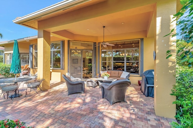 view of patio featuring an outdoor hangout area and ceiling fan