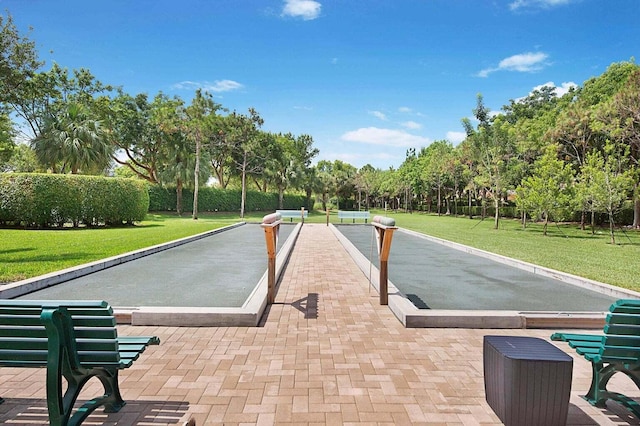 view of swimming pool with a lawn