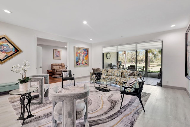 living room with light hardwood / wood-style flooring