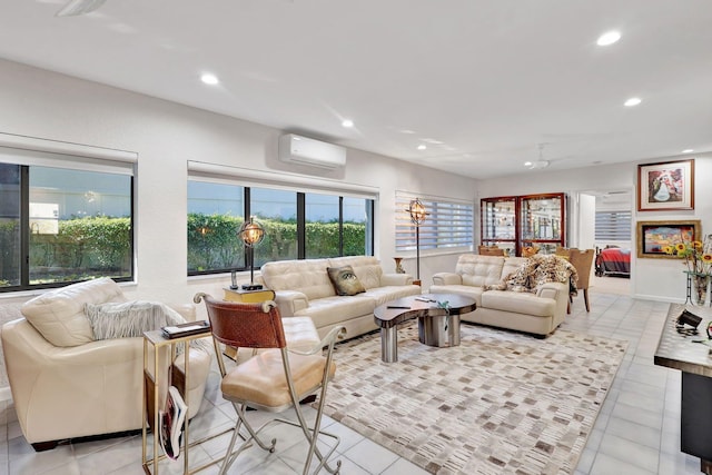 living room featuring a wall mounted air conditioner and light tile patterned floors