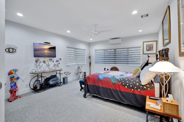 carpeted bedroom with a wall mounted air conditioner and ceiling fan