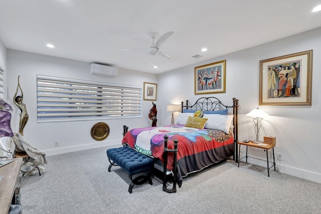 carpeted bedroom featuring a wall unit AC and ceiling fan