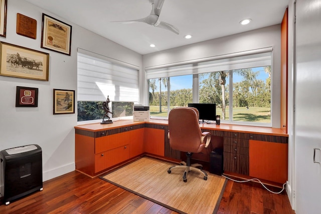 office space with ceiling fan and dark hardwood / wood-style floors