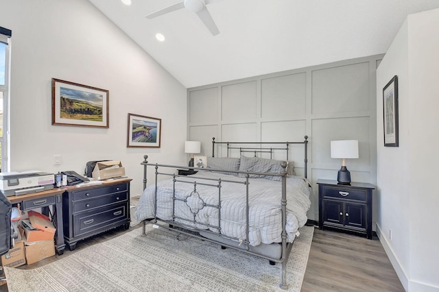 bedroom with lofted ceiling, wood-type flooring, and ceiling fan