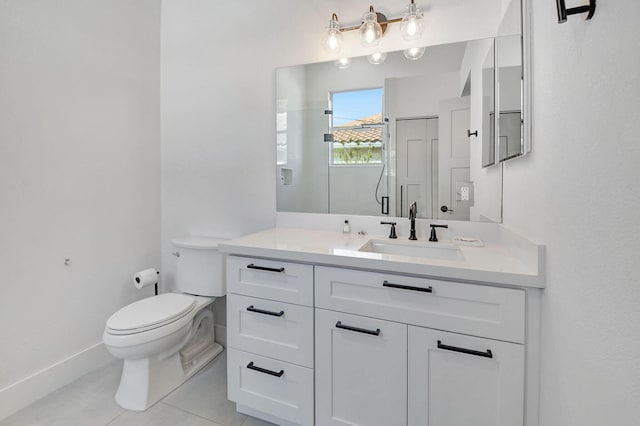 bathroom with tile patterned floors, vanity, and toilet