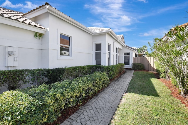 view of property exterior featuring a yard