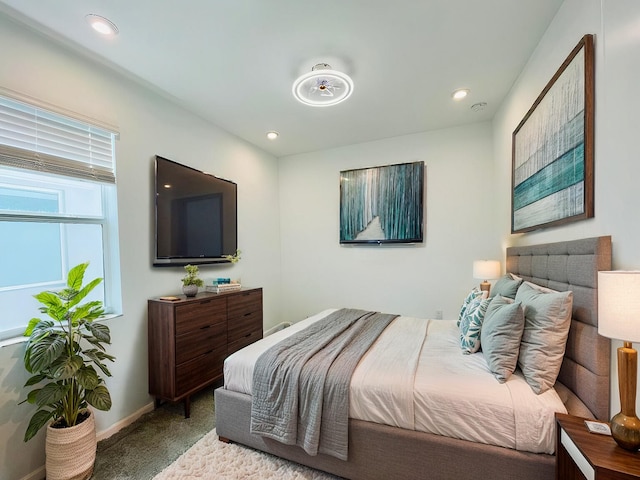 carpeted bedroom featuring recessed lighting and baseboards