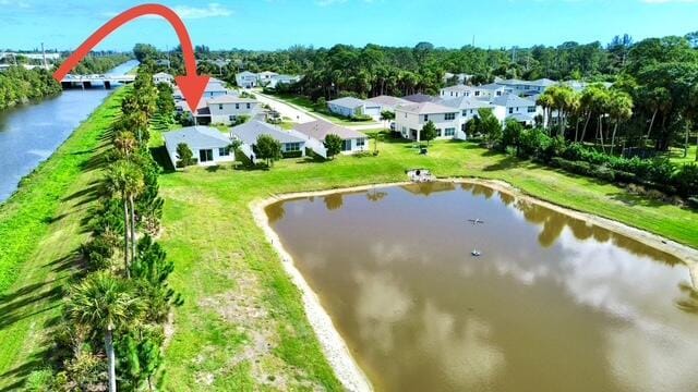 birds eye view of property featuring a water view