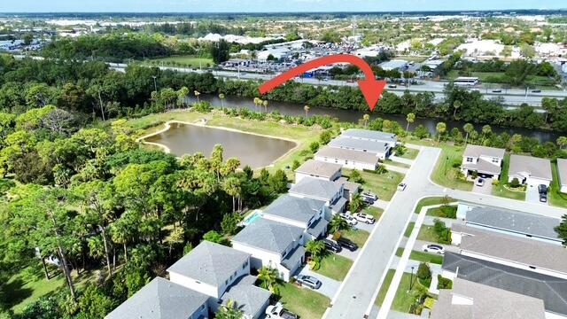 6716 Pointe Of Woods Dr, West Palm Beach, FL 33413 - bird's eye view with a residential view and a water view