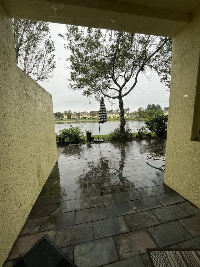 view of patio featuring a water view