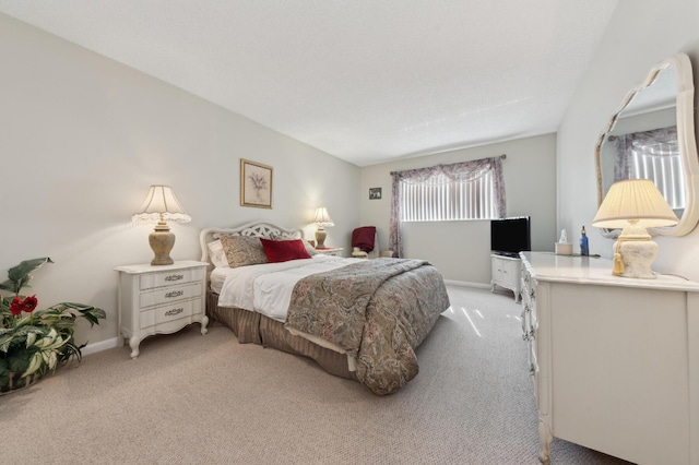 bedroom featuring light colored carpet