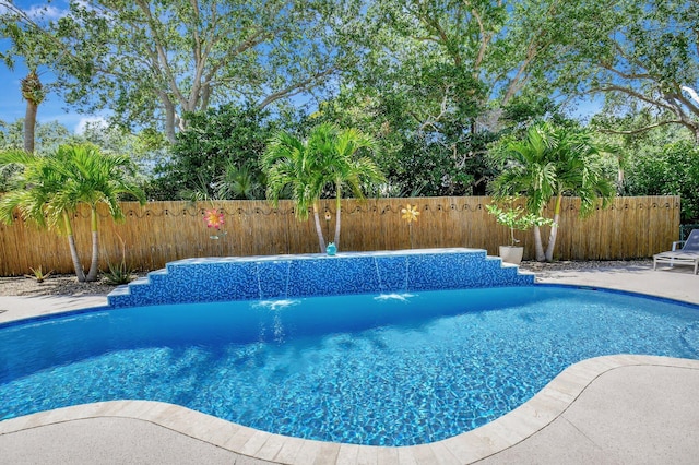 view of swimming pool featuring a fenced backyard and a fenced in pool