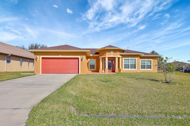 view of front of house featuring a garage and a front yard