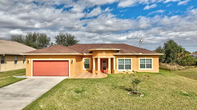 view of front of house featuring a garage and a front lawn