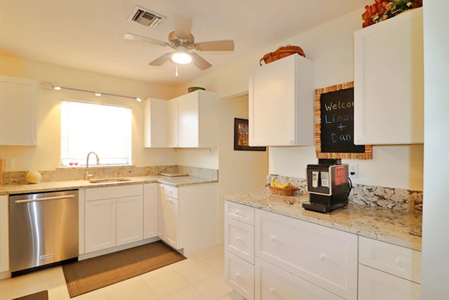 kitchen with sink, white cabinetry, stainless steel dishwasher, ceiling fan, and light stone countertops