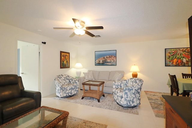 tiled living room featuring ceiling fan