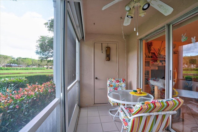 sunroom / solarium with ceiling fan