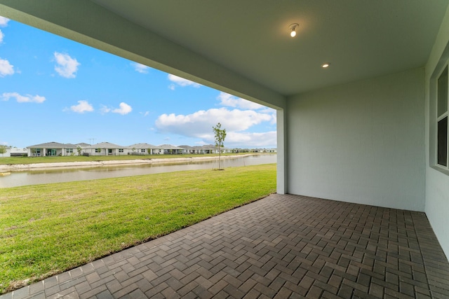 view of patio / terrace featuring a water view