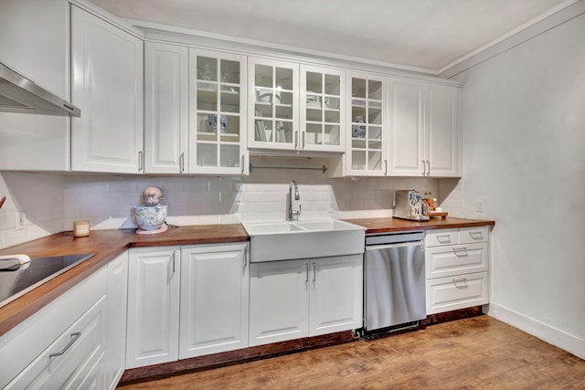 kitchen featuring white cabinetry, wooden counters, and sink