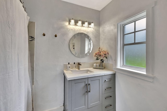 bathroom featuring a healthy amount of sunlight and vanity