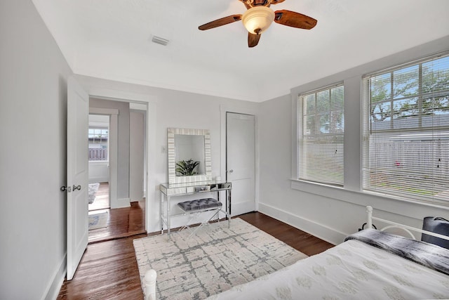 bedroom featuring ceiling fan and dark hardwood / wood-style flooring