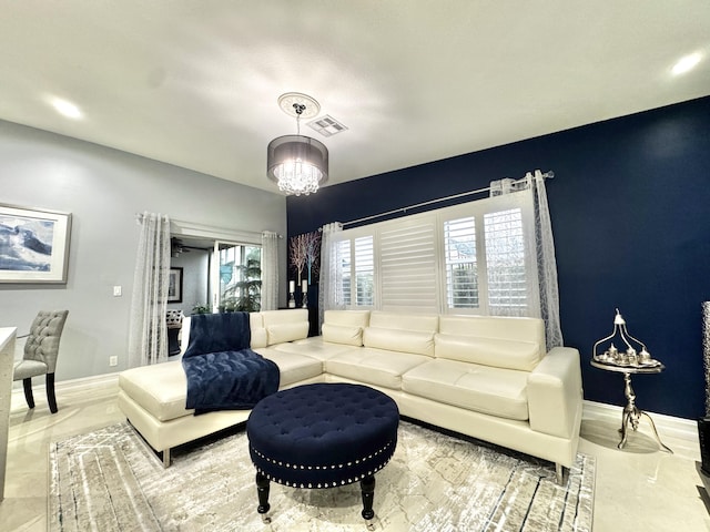 living room featuring an inviting chandelier